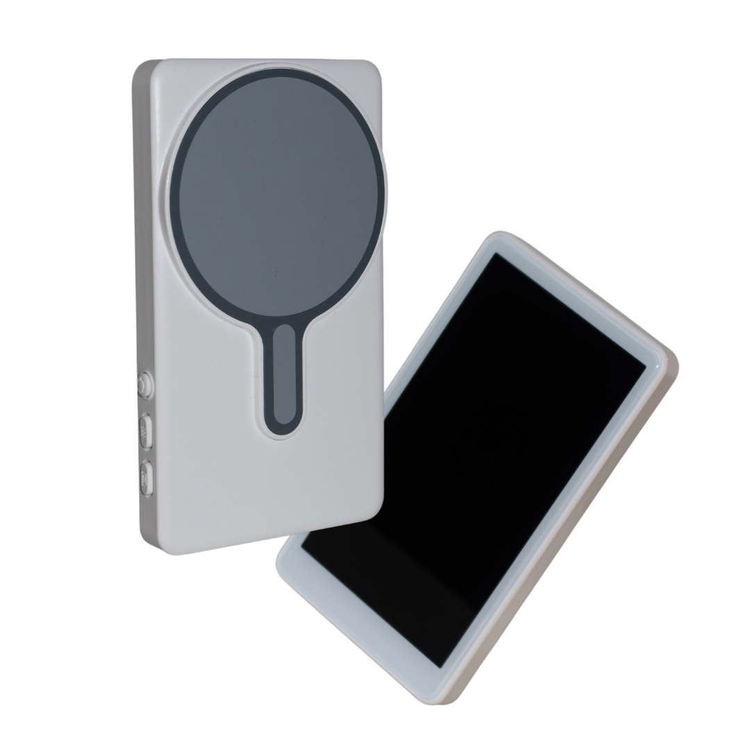 Magnetic selfie monitor attached to the back of a smartphone for filming set up.